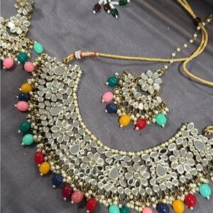 Earrings and tika and one full set